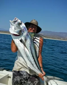Mike Vos with roosterfish and sea of cortez ocean in the background